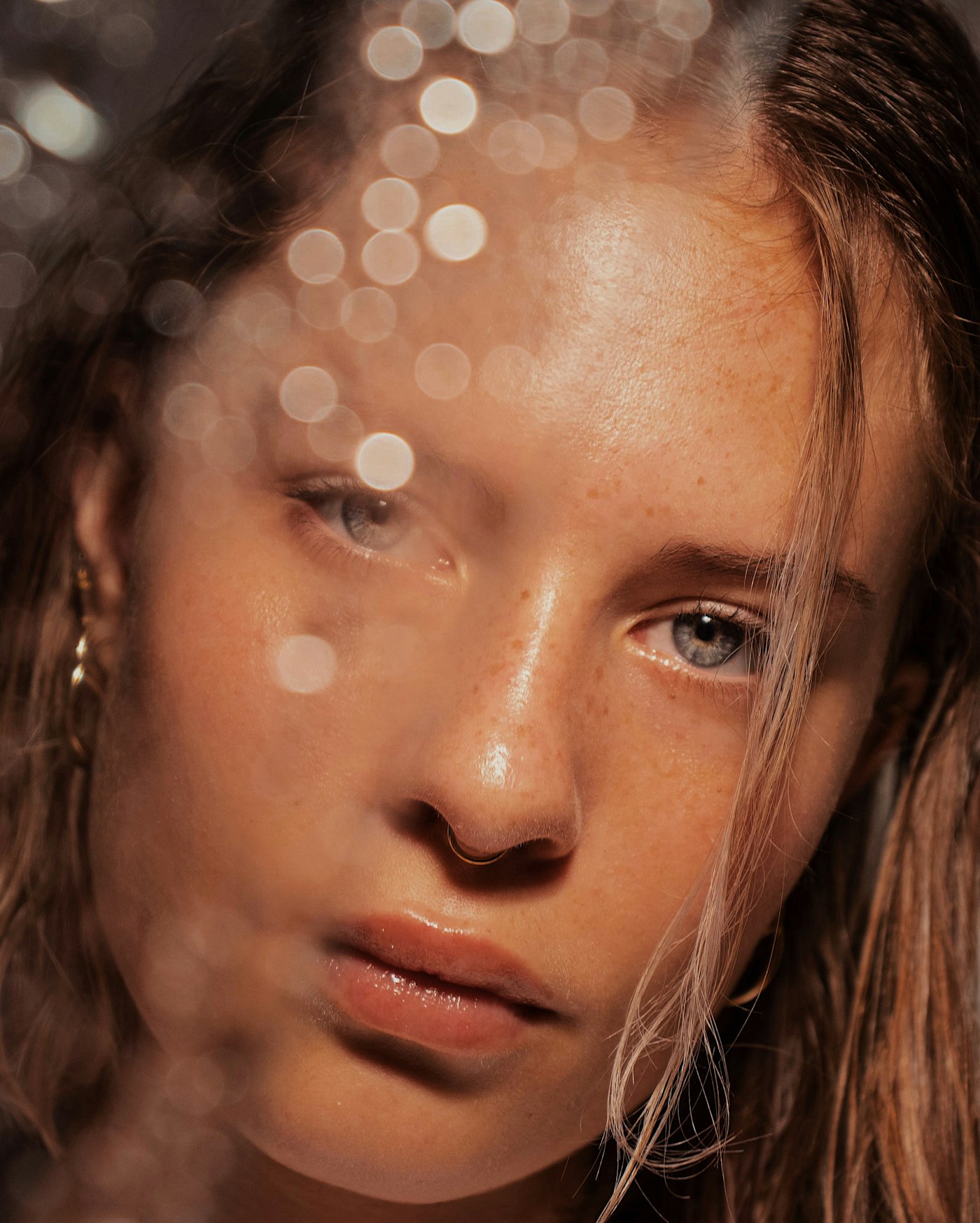 Close portrait of a woman with soft, loose hair